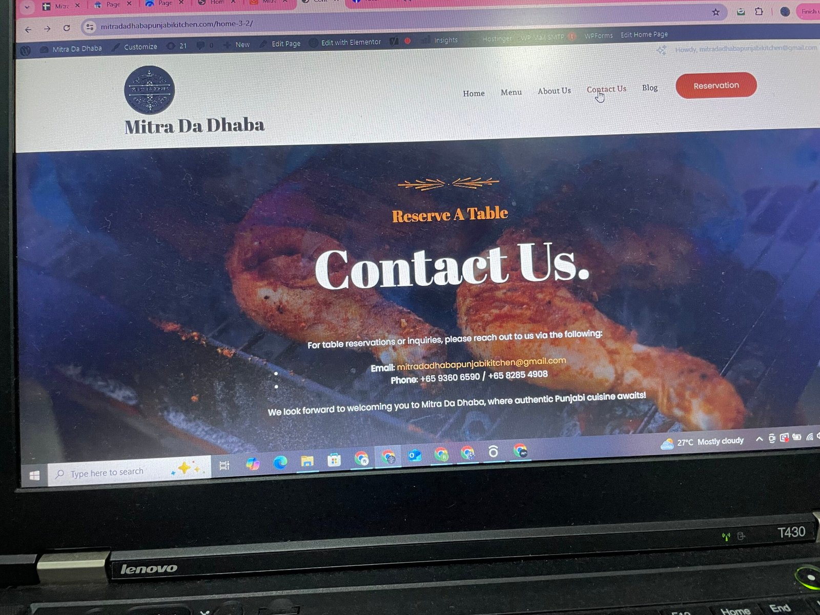 Mitra Da Dhaba website Contact Us page showcasing restaurant contact details, reservation information, and Punjabi kitchen branding.